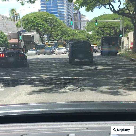 Traffic stop on green Toyota sedan near Kapiolani