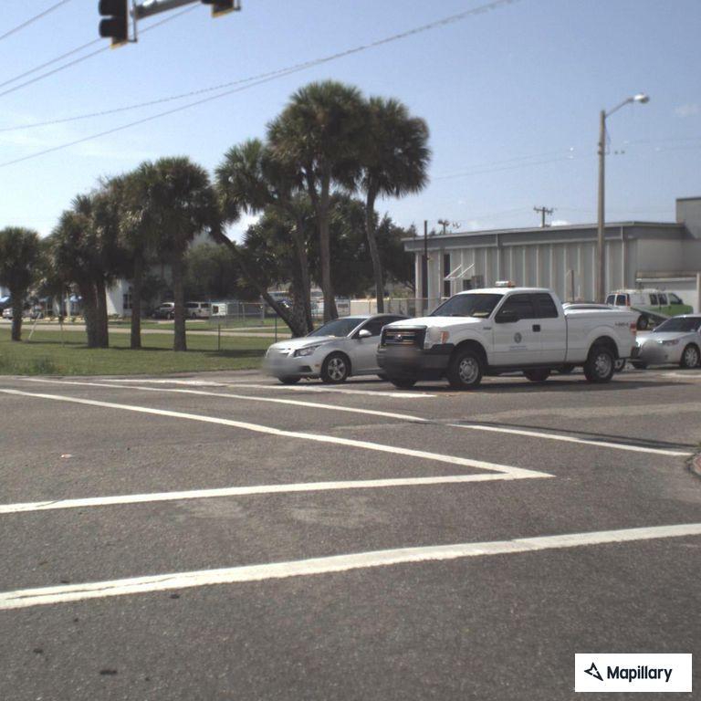Person with sign creating traffic hazard on roadway