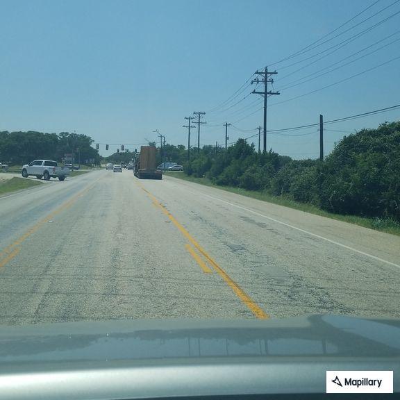 SUV driving without rear lights on Highway 46
