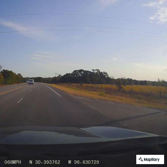 Truck dragging loose gate creating sparks on highway