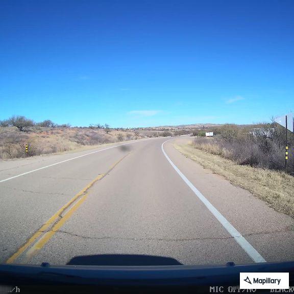 Red SUV blocking lane on West Arivaca Road