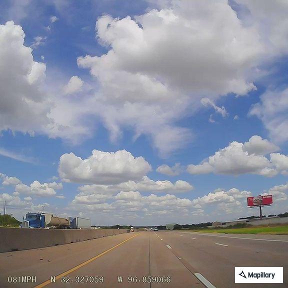 Motorcycle weaving through traffic on I-35E