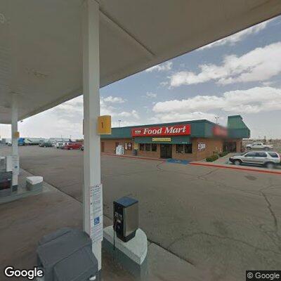 Person having cardiac issues near gas station sign