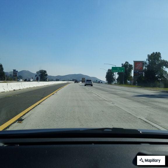 Sleepy driver in white truck on I-15