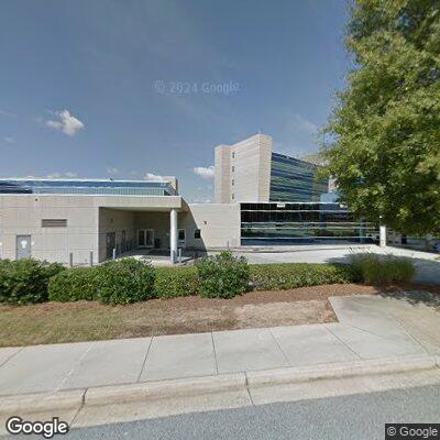 Pregnant woman in black car outside Emory Hillandale Hospital