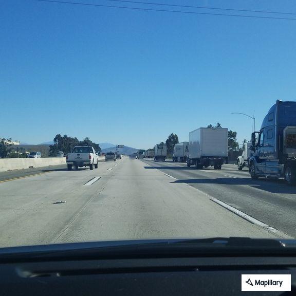 Abandoned bumper in slow lane on westbound 60