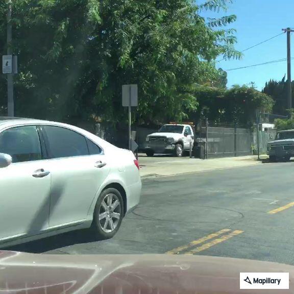 Woman throwing items on West Sunset Boulevard
