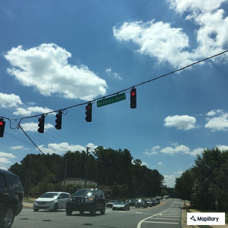 Traffic stop with red Volkswagen at Publix lot