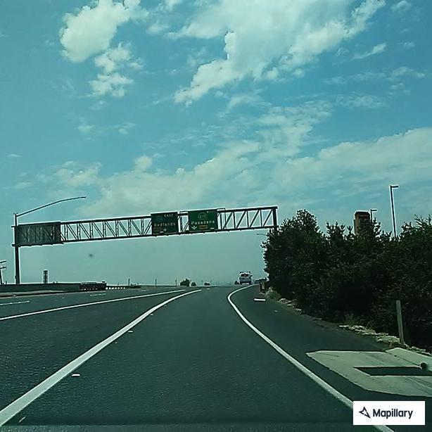 Man reportedly hitting woman on highway ramp
