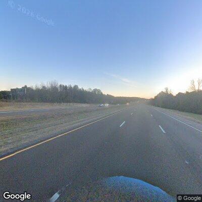 Elderly woman changing tire on I-55 shoulder