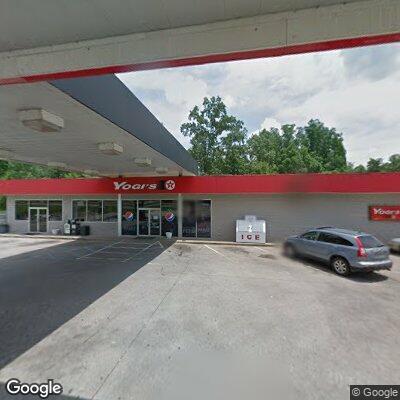 Woman possibly asleep in car at gas station pump