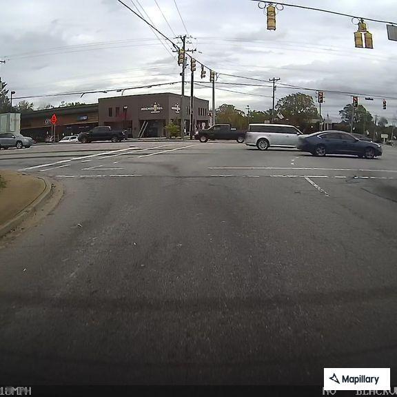 Traffic stop involving black Charger at intersection
