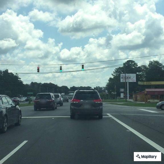 Semi truck swerving and running red lights on US 74