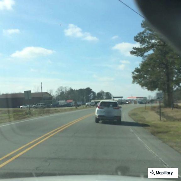 Stranded vehicle stopped in middle of roadway
