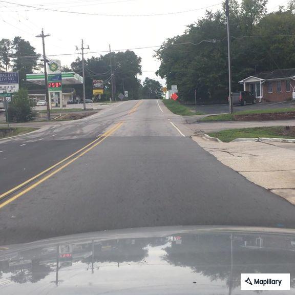 Traffic stop on gray SUV at car wash