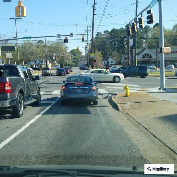 Stolen license plate on red SUV near Brainerd Road