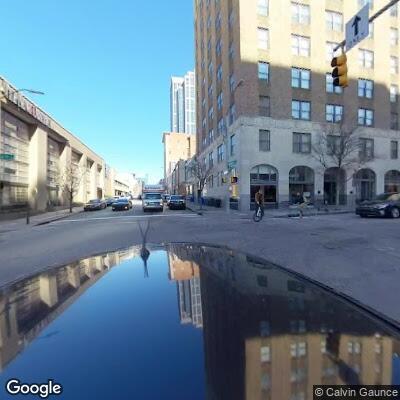 Male lying on ground requests EMS at downtown intersection