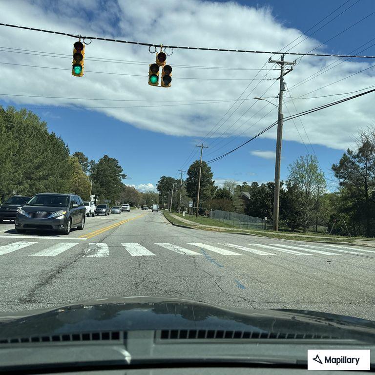 Person on scooter weaving through South Main traffic