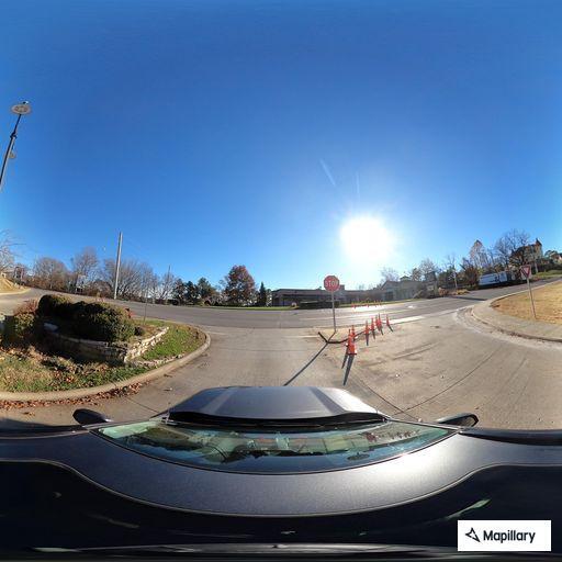 Motorcycle laid down at highway junction, no injuries