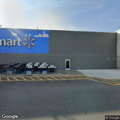 Man pacing in Walmart parking lot with backpacks