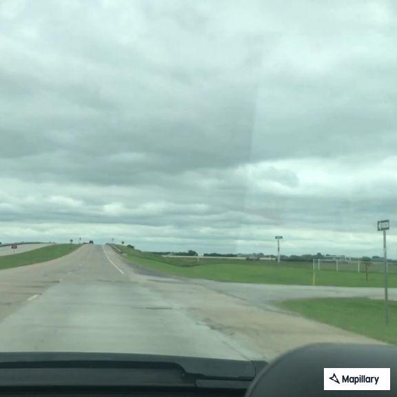 Loose panel on semi trailer on Highway 69
