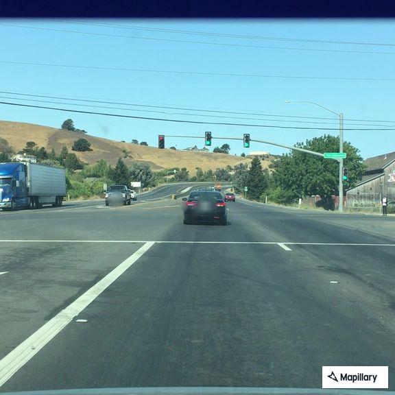 Two cars racing near Highway 156 in San Juan Bautista