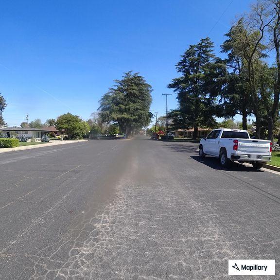 Person experiencing abdominal pain in Madera