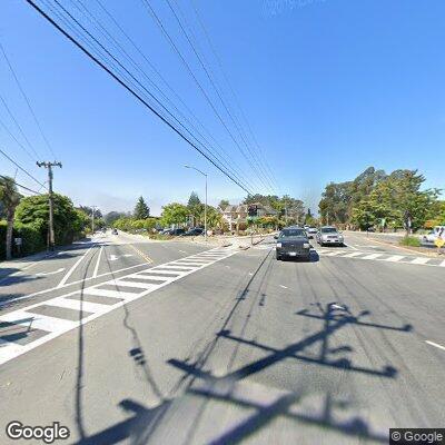 Person walking on Soquel Drive with vodka bottle