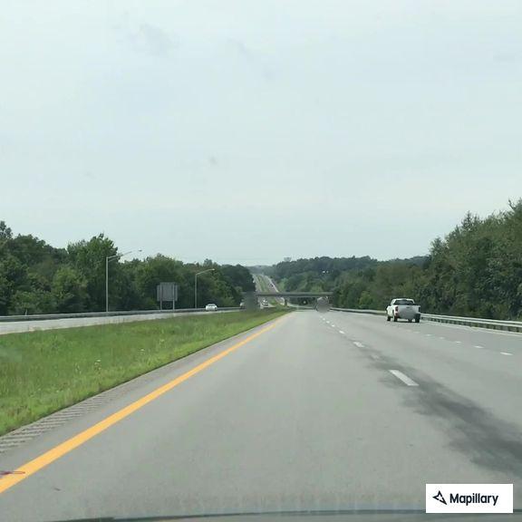 Reckless driver swerving and hitting guardrail