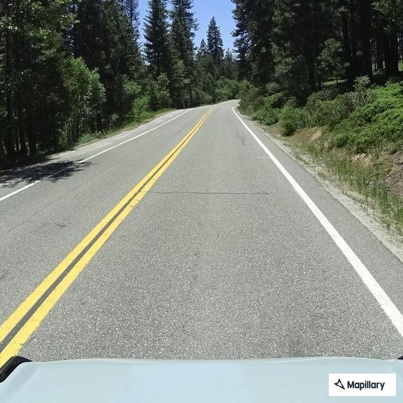 Reckless blue SUV passing on double yellow line