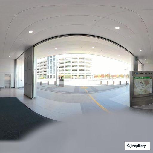 Woman in 40s with back pain in parking structure