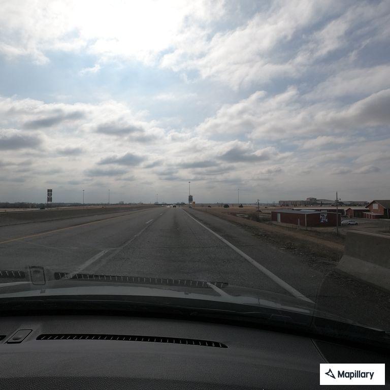 Unsafe silver minivan entering southbound turnpike