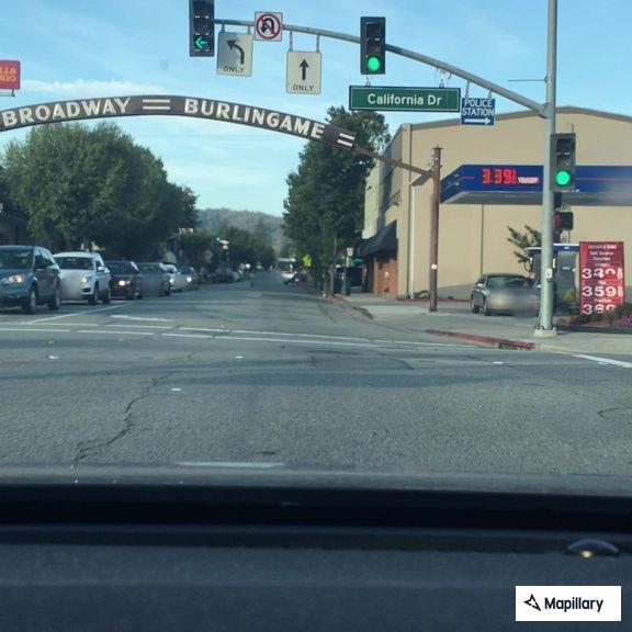 Flatbed truck hits barricade at Broadway crossing