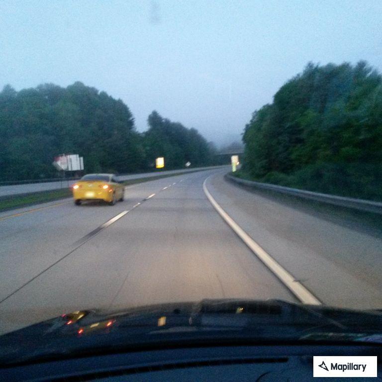 Man sitting by disabled car on I-64 mile 125.5 in Beaver