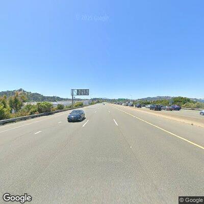 Disoriented shirtless man sitting on highway shoulder
