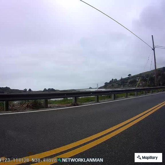 Sideways vehicle with dog on State Route 1