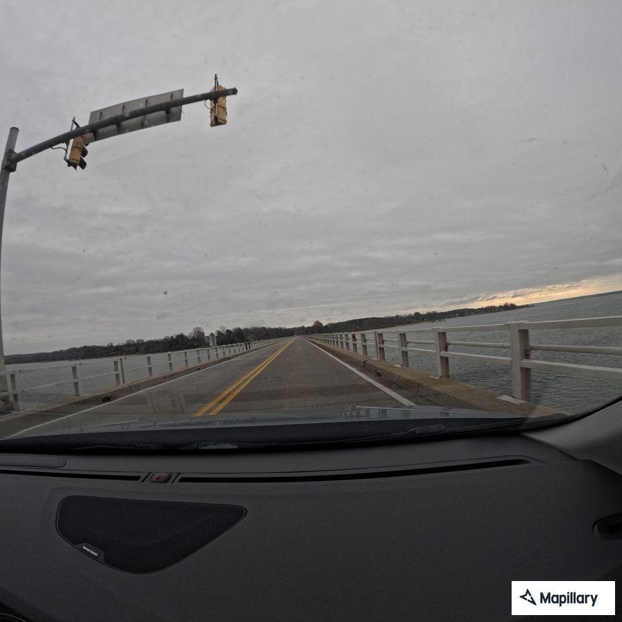 Truck reportedly sideswipes vehicle on bridge