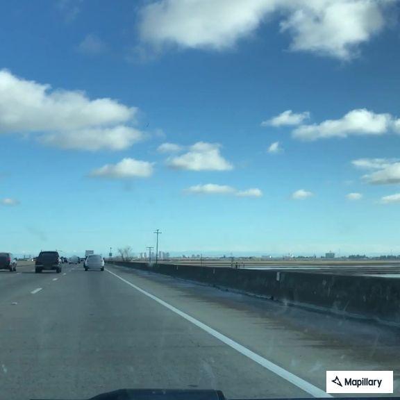 Stalled car blocks middle lane on I-80 West bridge
