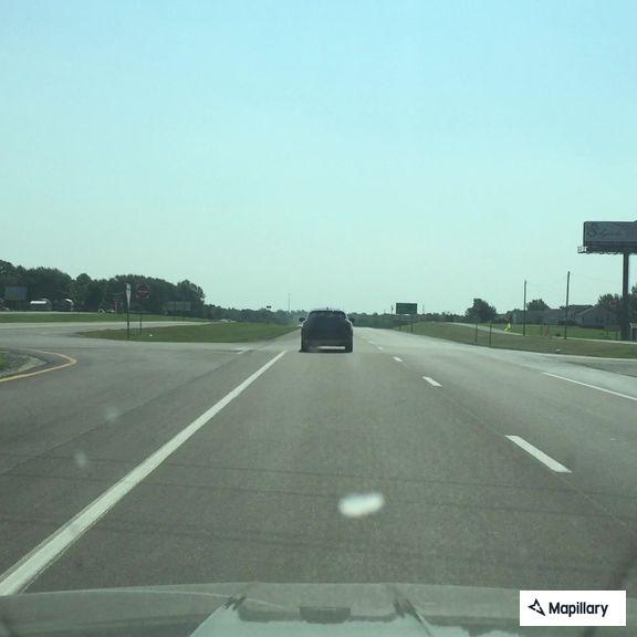 Pickup truck out of gas on highway shoulder