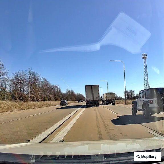 Truck with trailer parked on interstate without lights