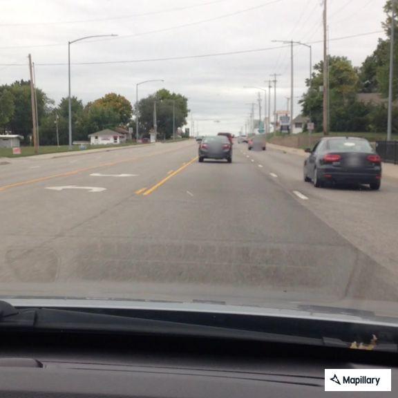 Police search for two suspects near Main Street woods