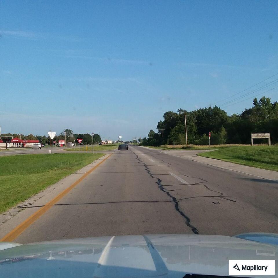 Traffic stop on black passenger car near high school