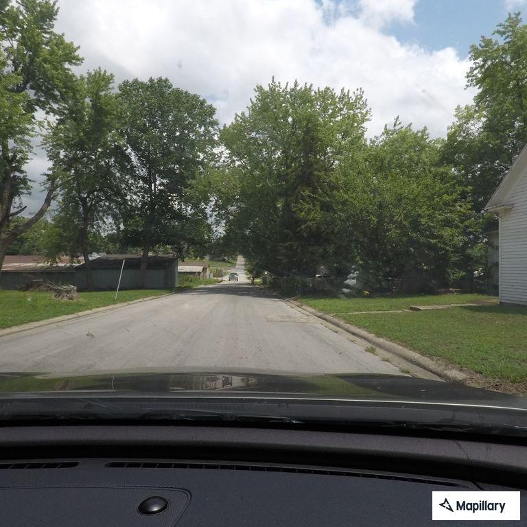 Pickup driving without headlights on Washington Street