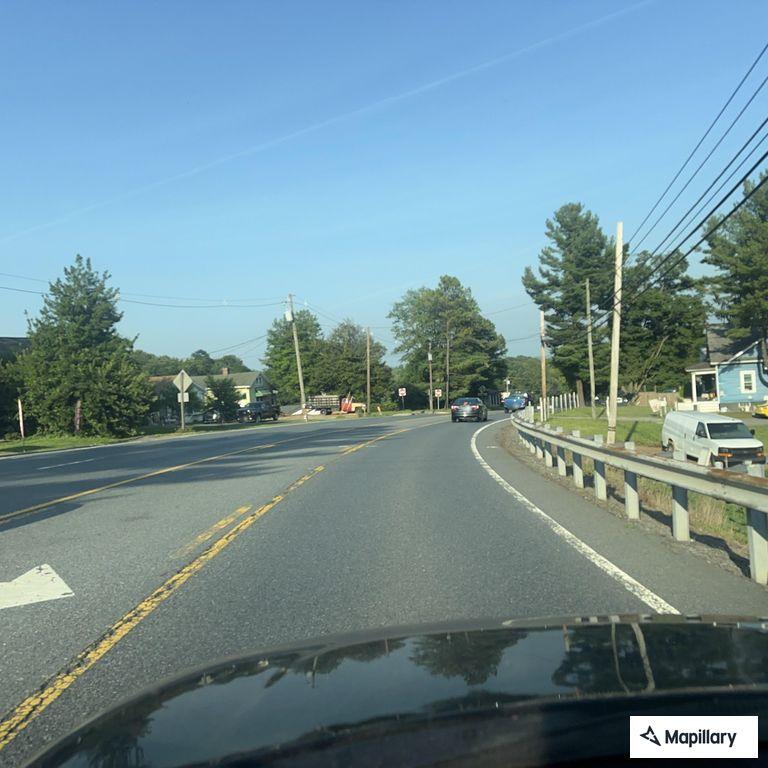 Driver asleep in car stopped on roadside shoulder