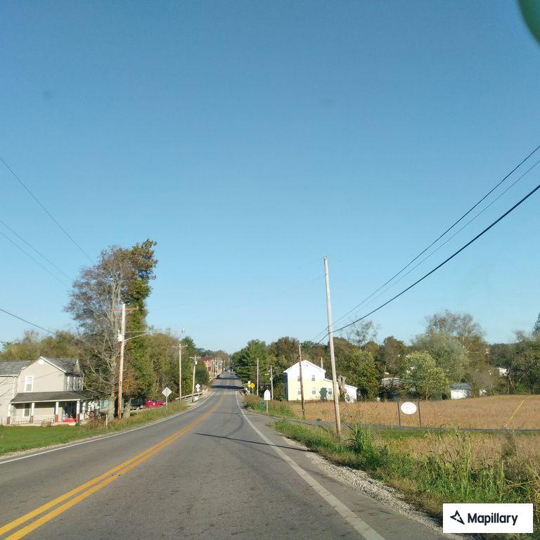 man slumped over wheel in gray car on State Route 159