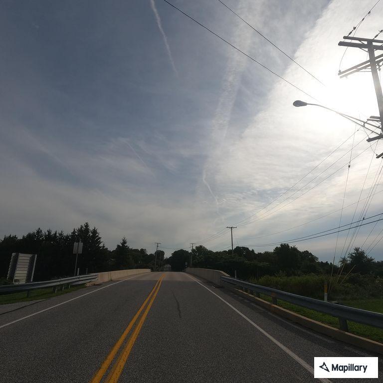 Person experiencing chest pain on highway ramp