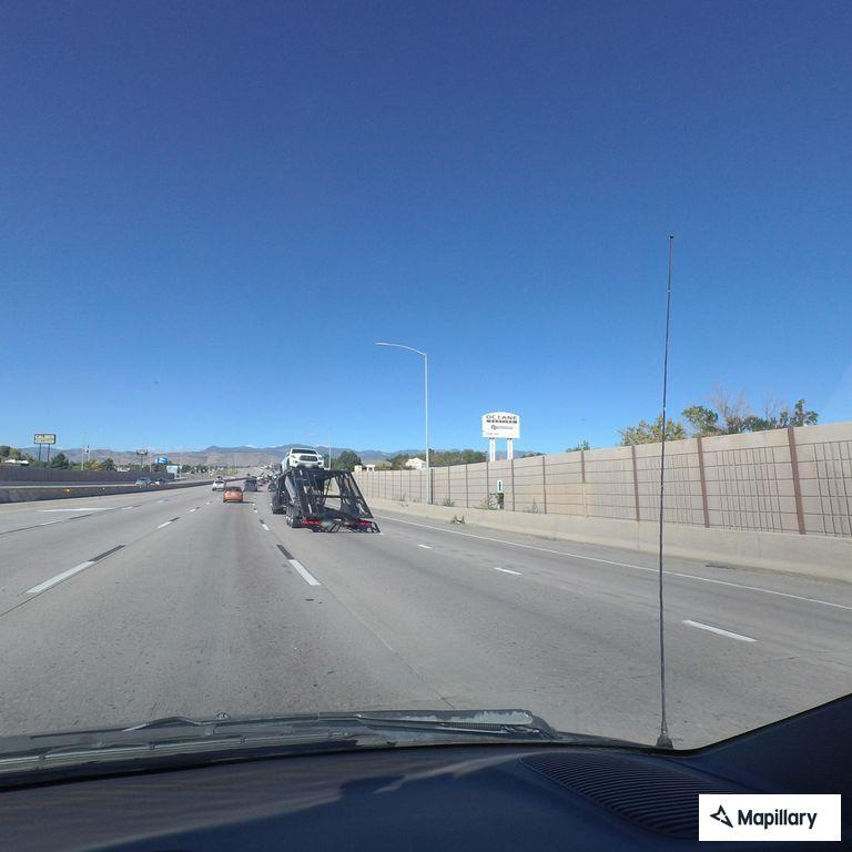Vehicles on shoulder and animal carcass on I-70 ramp