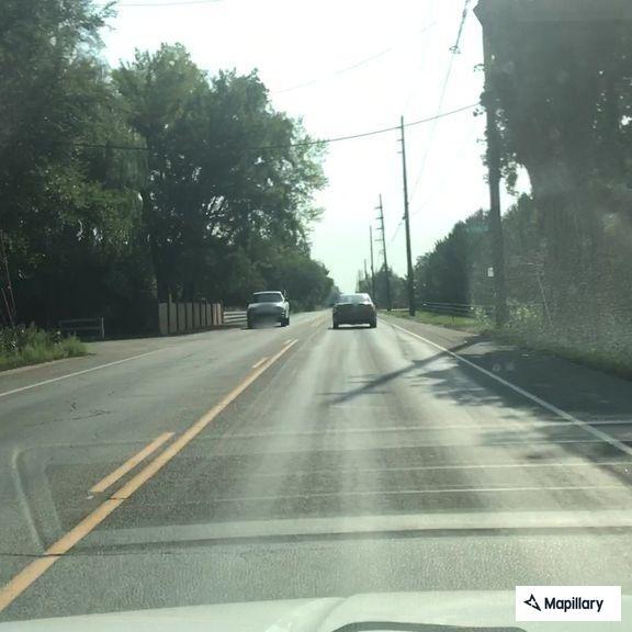 Person standing in roadway on Diagonal Highway