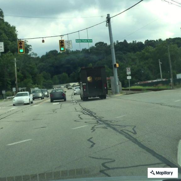 Report of people riding in back of moving truck