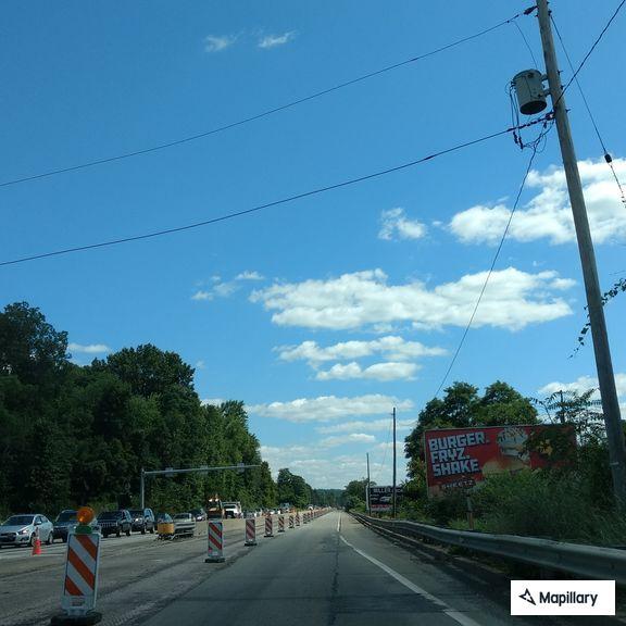 Disabled dump truck blocking right lane